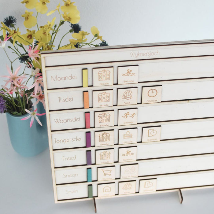 Houten weekplanner in een andere taal